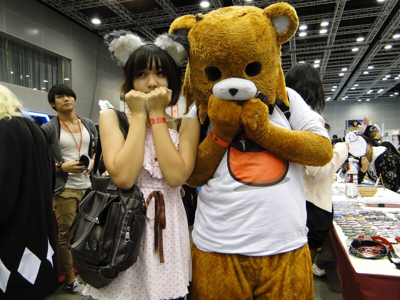 Cosplayers posing at a convention