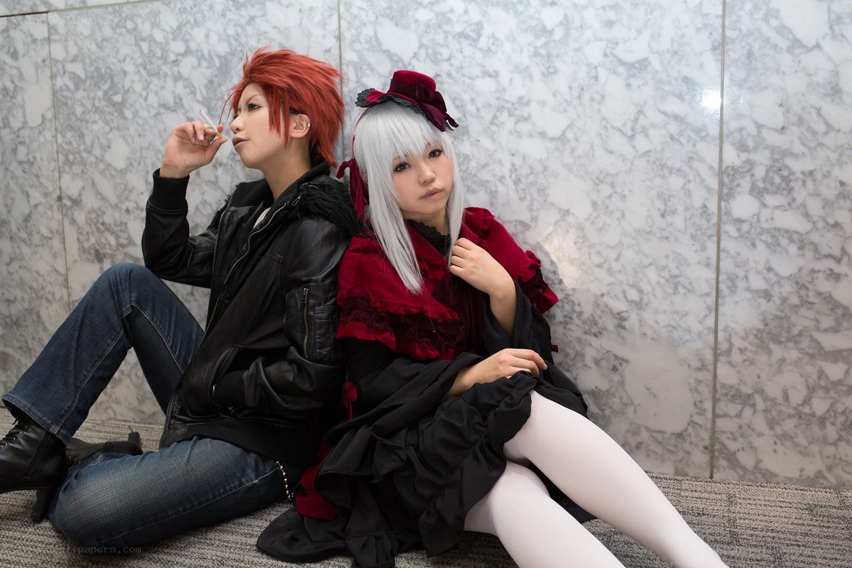 Cosplayers sitting on floor