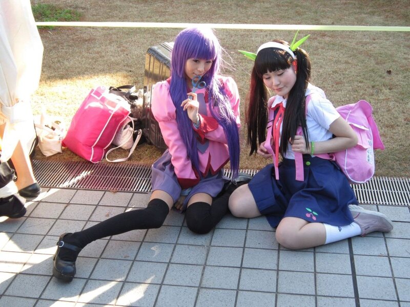Cosplayers sitting on the ground