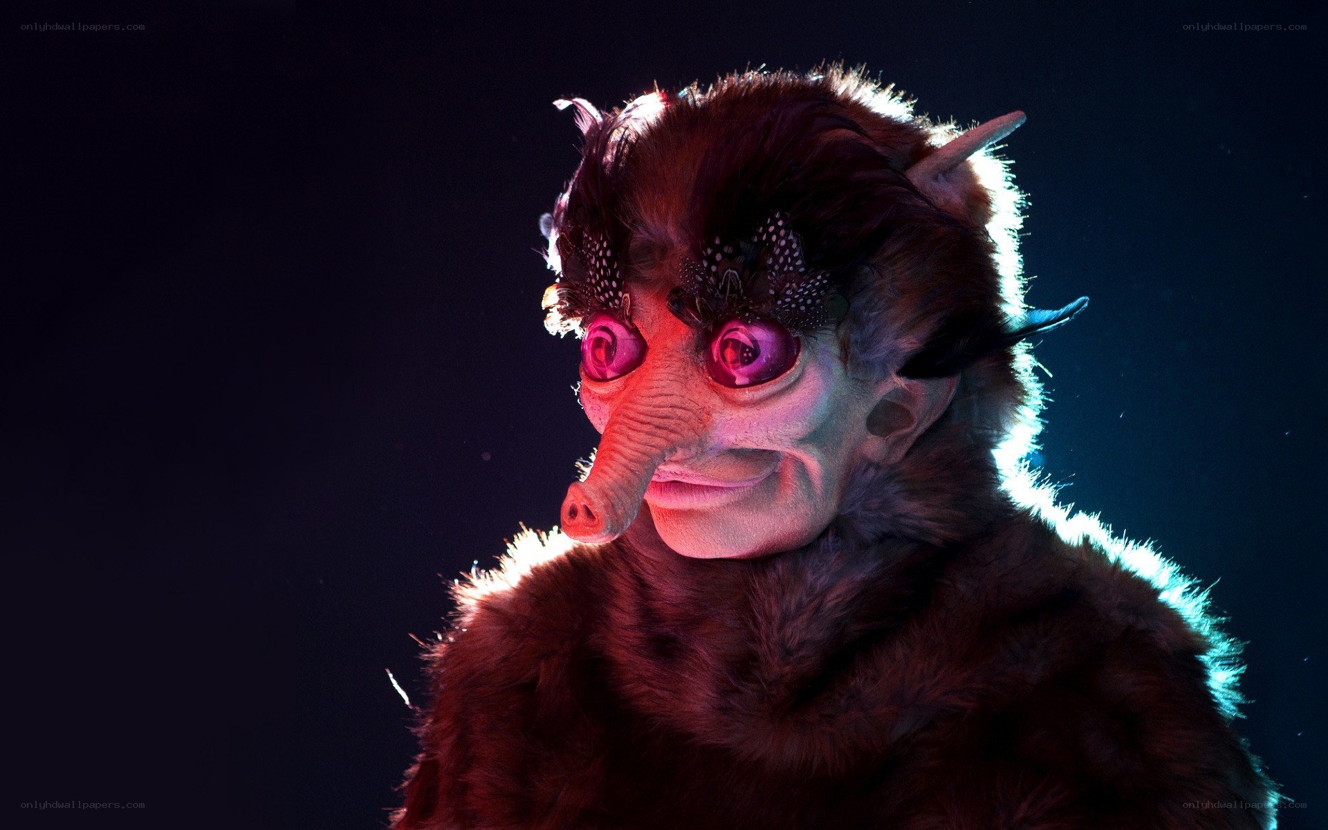 costumed creature with glowing eyes