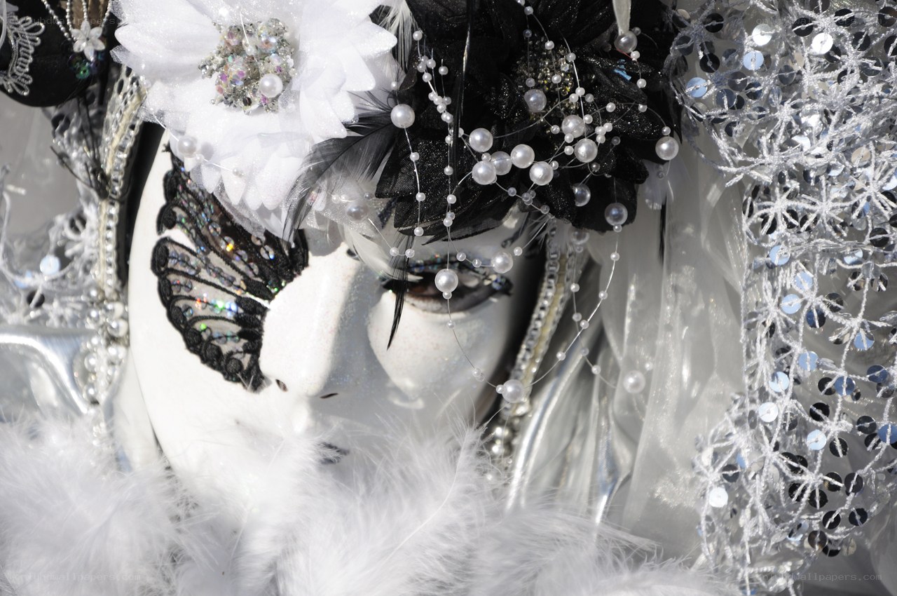 costumed figure with white mask