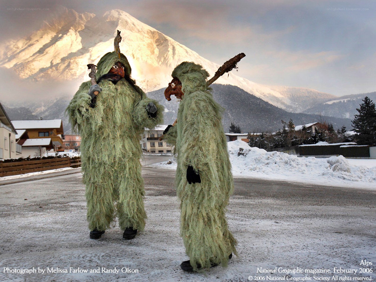 Costumed figures in Alps