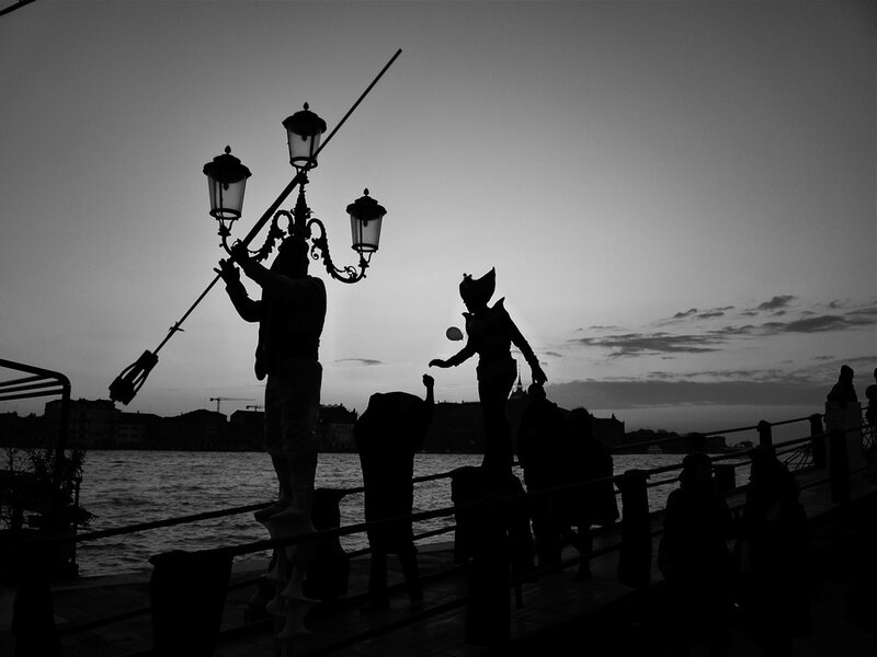 Costumed Figures on a Pier