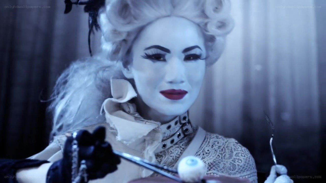 costumed performer with white makeup