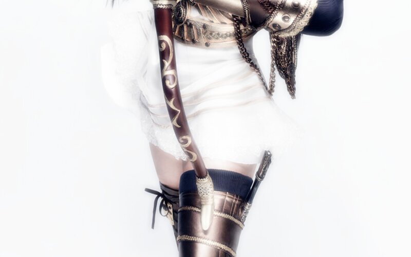 costumed warrior with ornate weapon