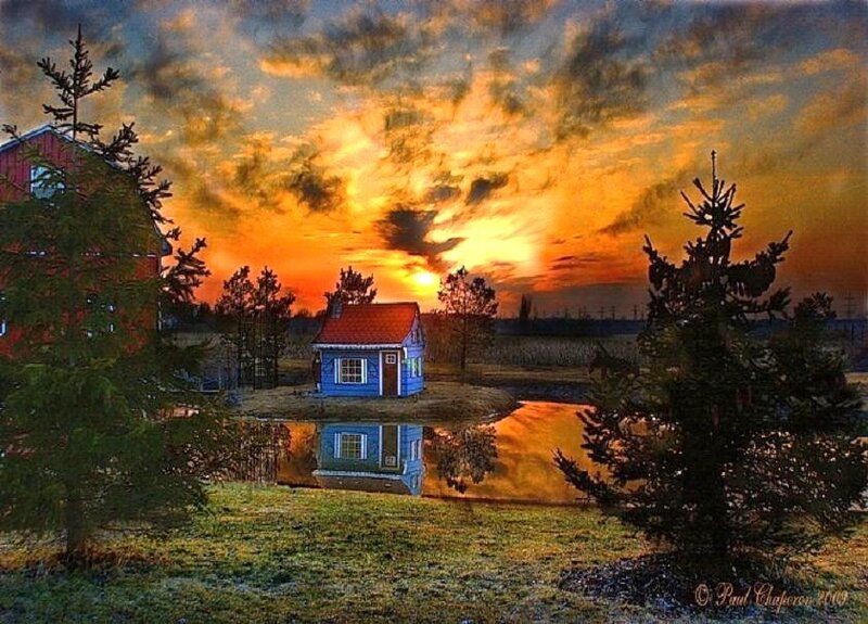 Cottage at sunset with reflection