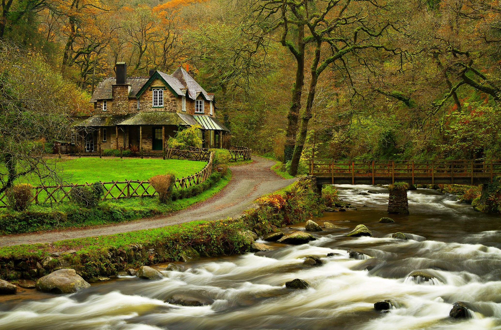 Cottage by a river in autumn