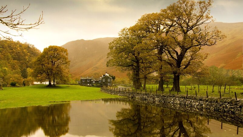 Cottage by the lake in autumn