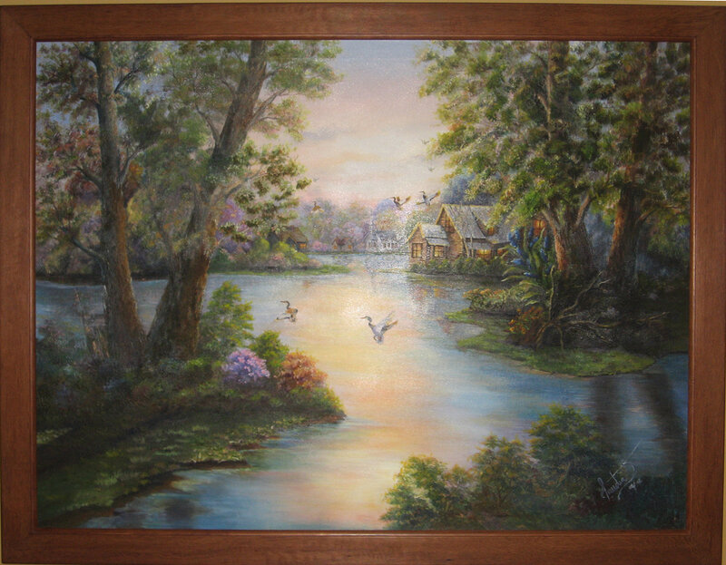 Cottage by the river at sunset