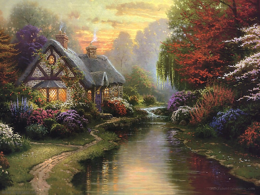 Cottage by the stream at sunset