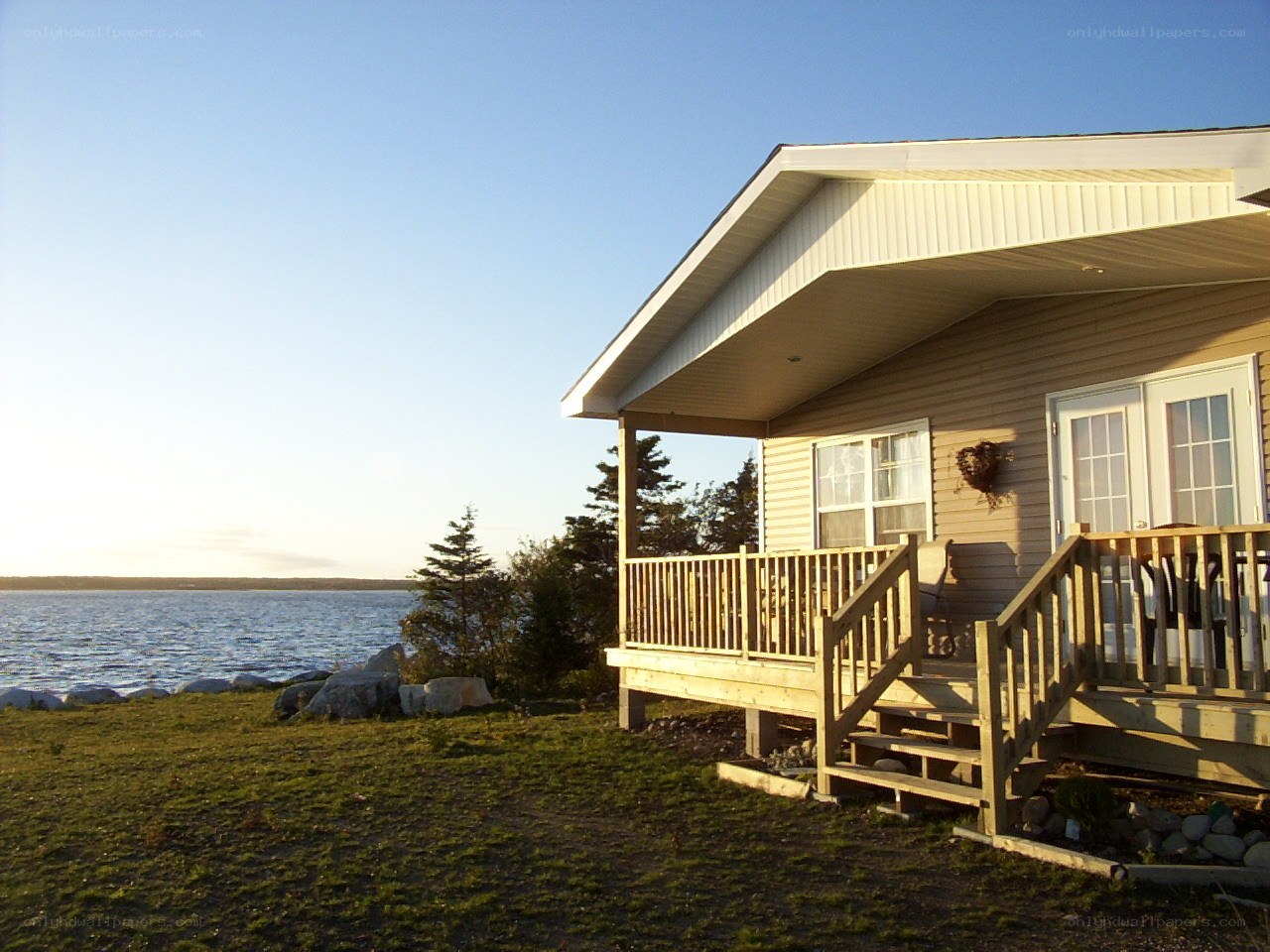 Cottage by the water at sunset