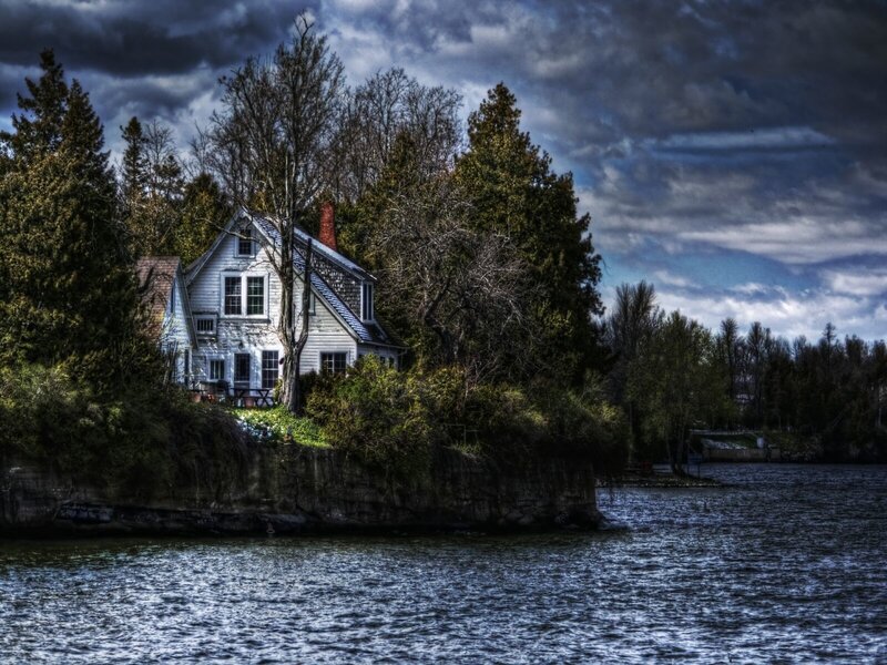 Cottage on a lakeside cliff