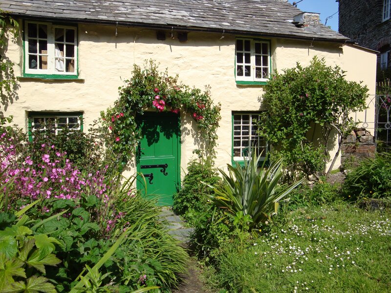 cottage with green door and garden