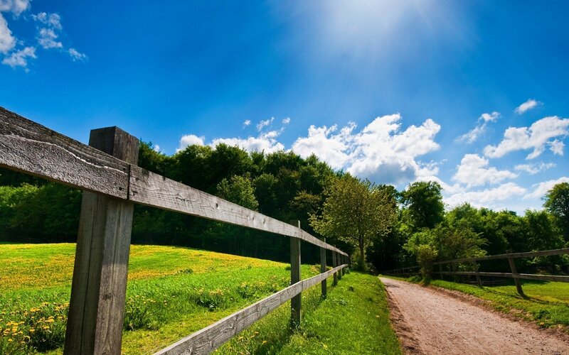 Country path with wooden fence