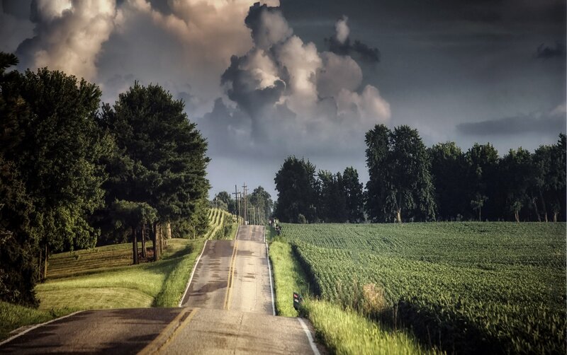 Country Road under Storm Clouds