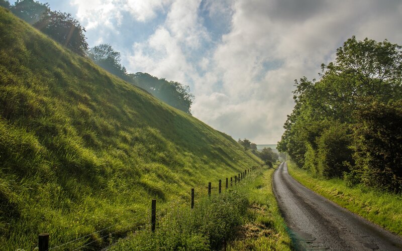 Country Road with Grassy Hill