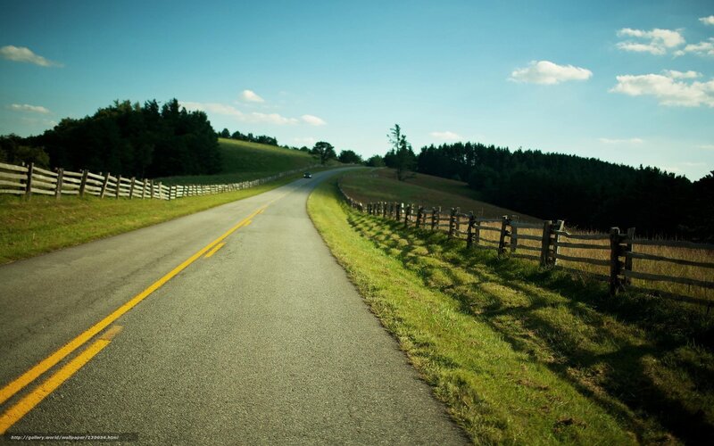 Country road with wooden fences