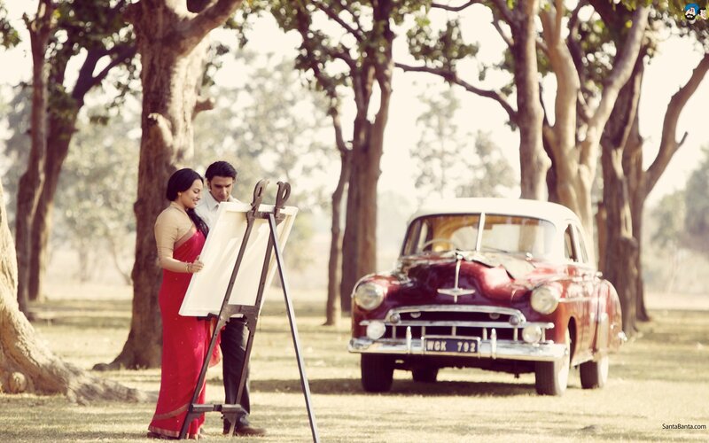 Couple at an easel in a park