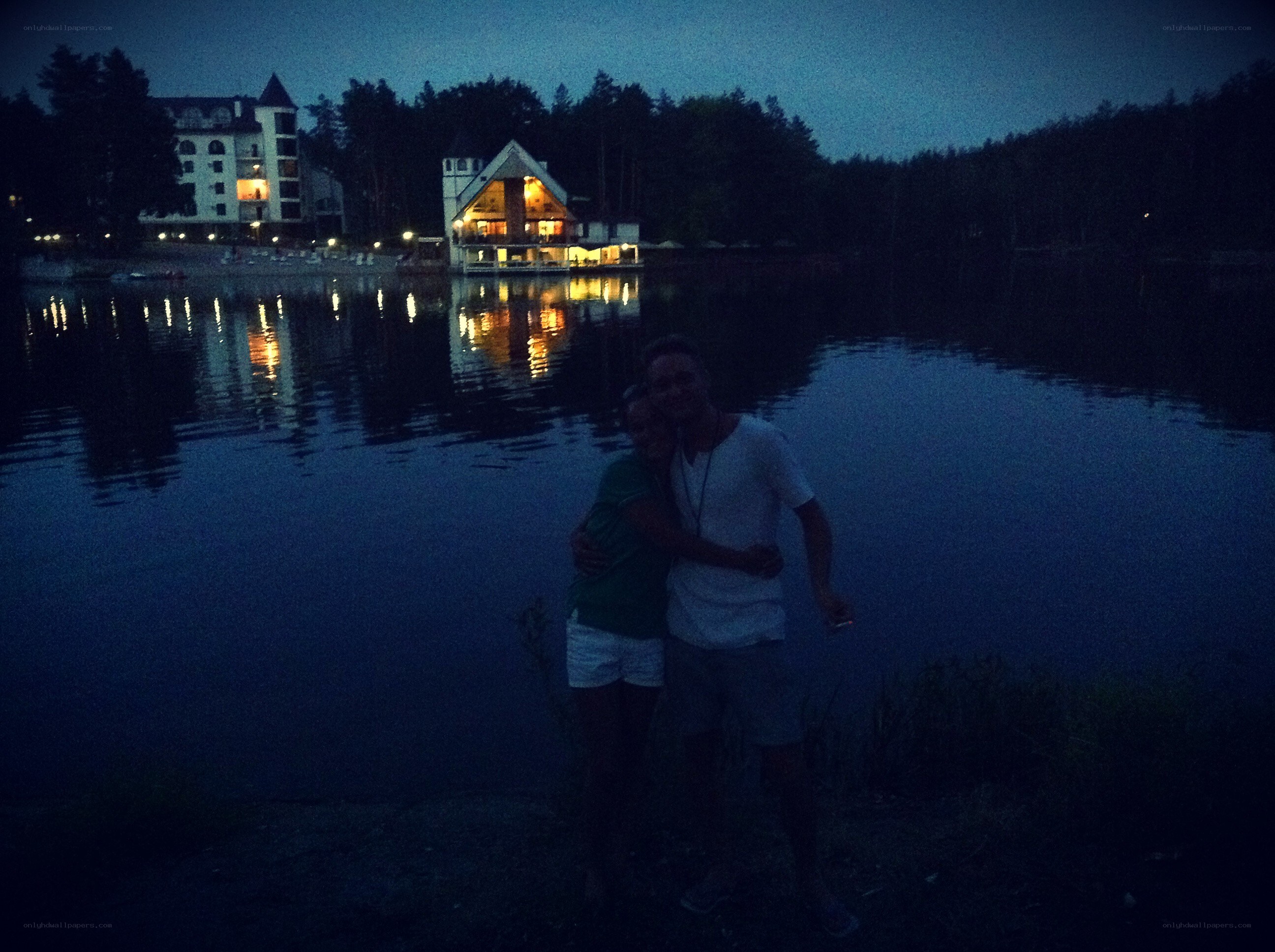 Couple at lake in evening