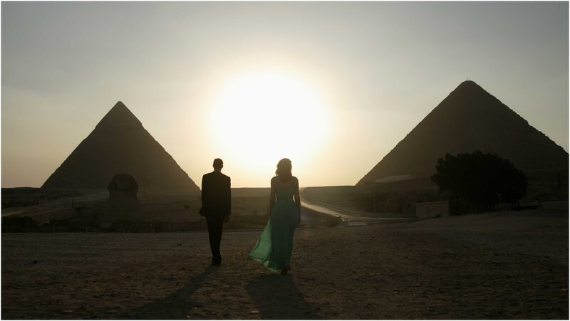 Couple at pyramids sunset