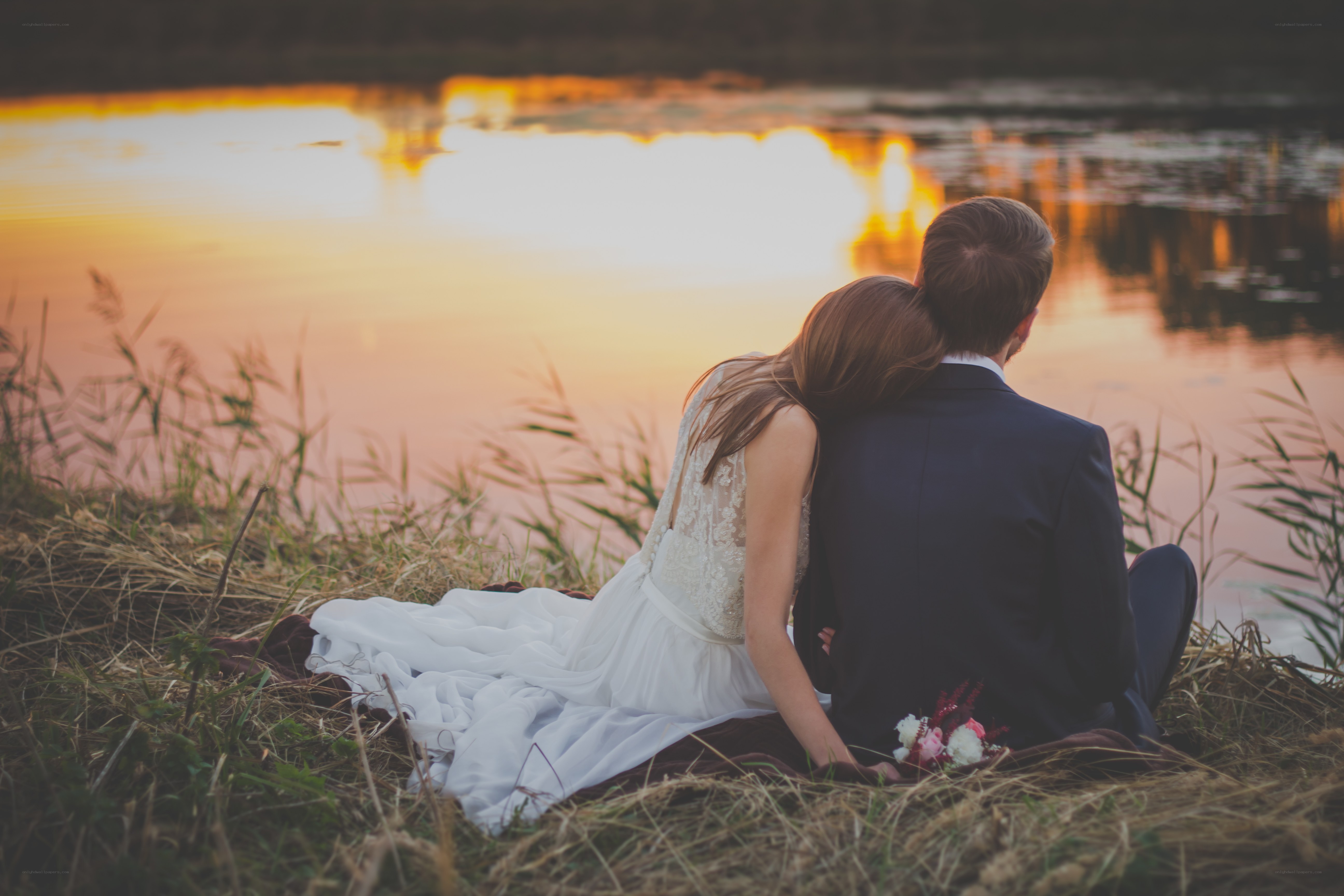 Couple at sunset by the lake