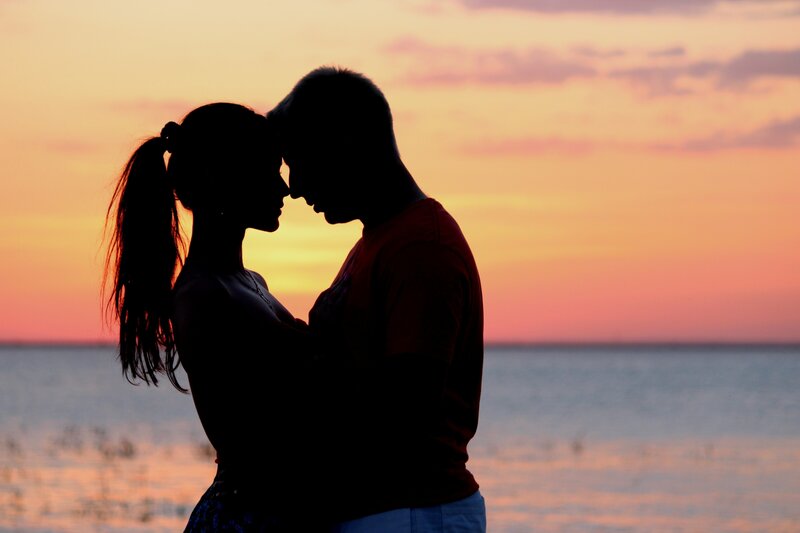 couple at sunset by the water