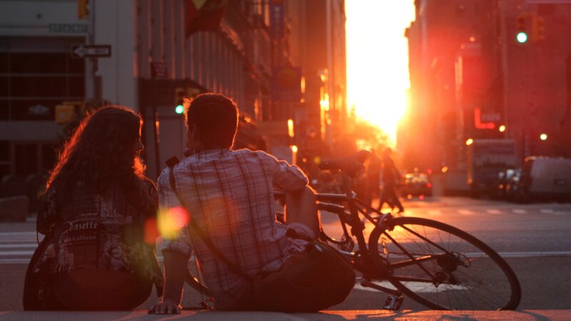Couple at sunset on city street