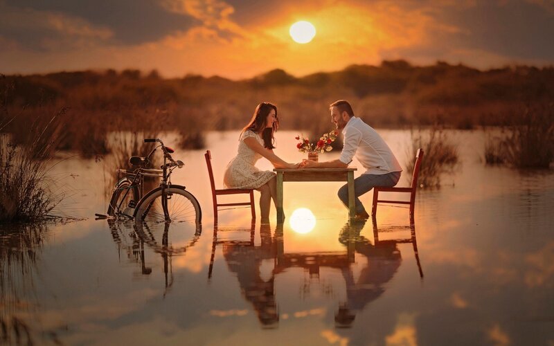 Couple at Table in Water — Orange