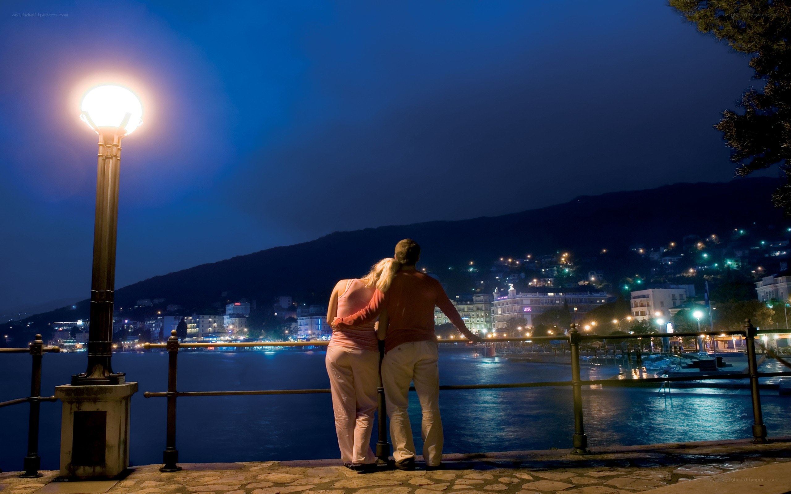 Couple at waterfront at night