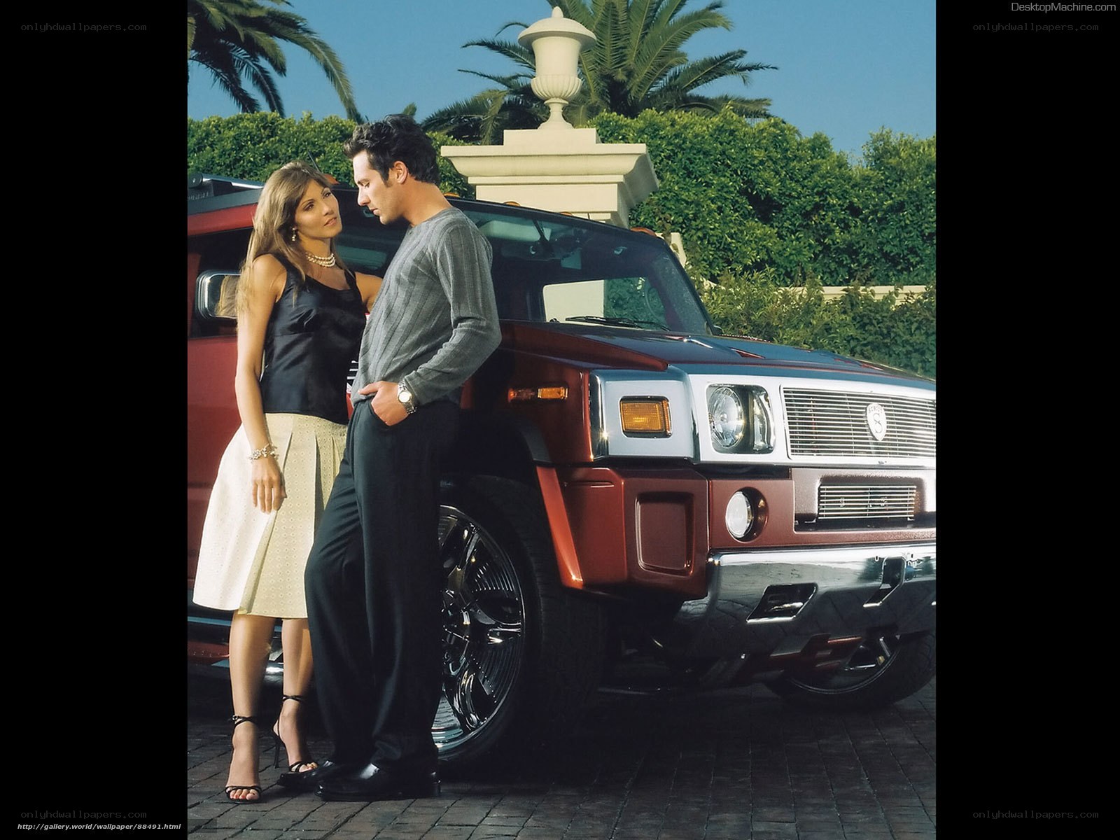 Couple by luxury SUV