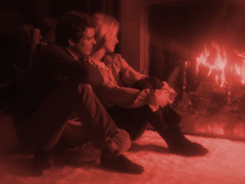 Couple by the fireplace