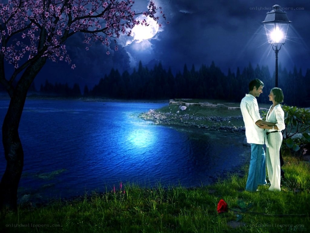 Couple by the lake at night