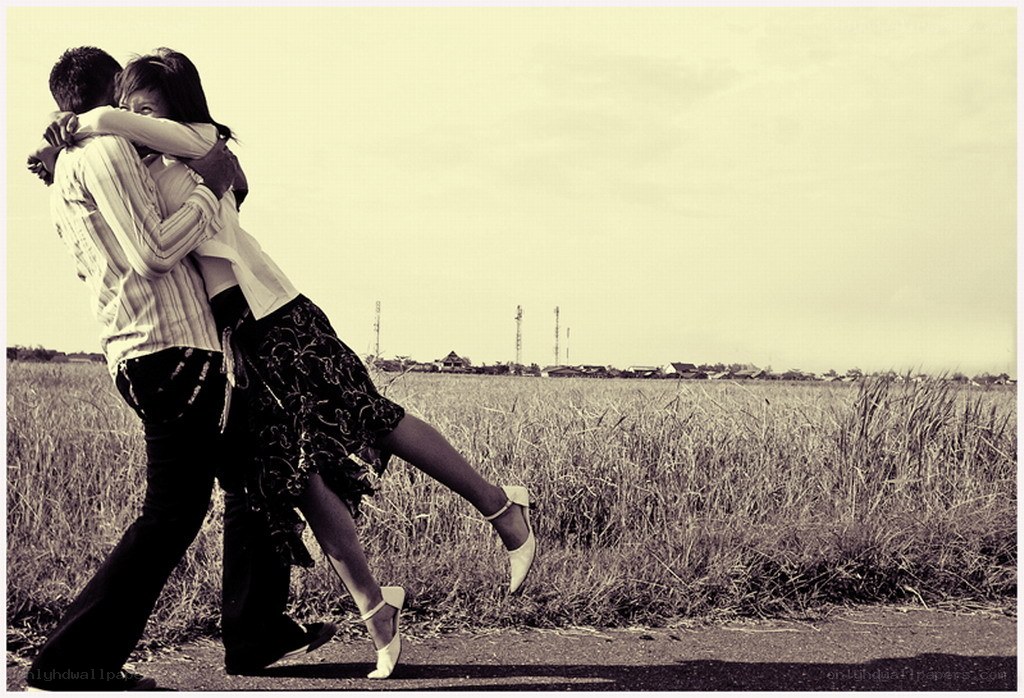 Couple dancing in a field