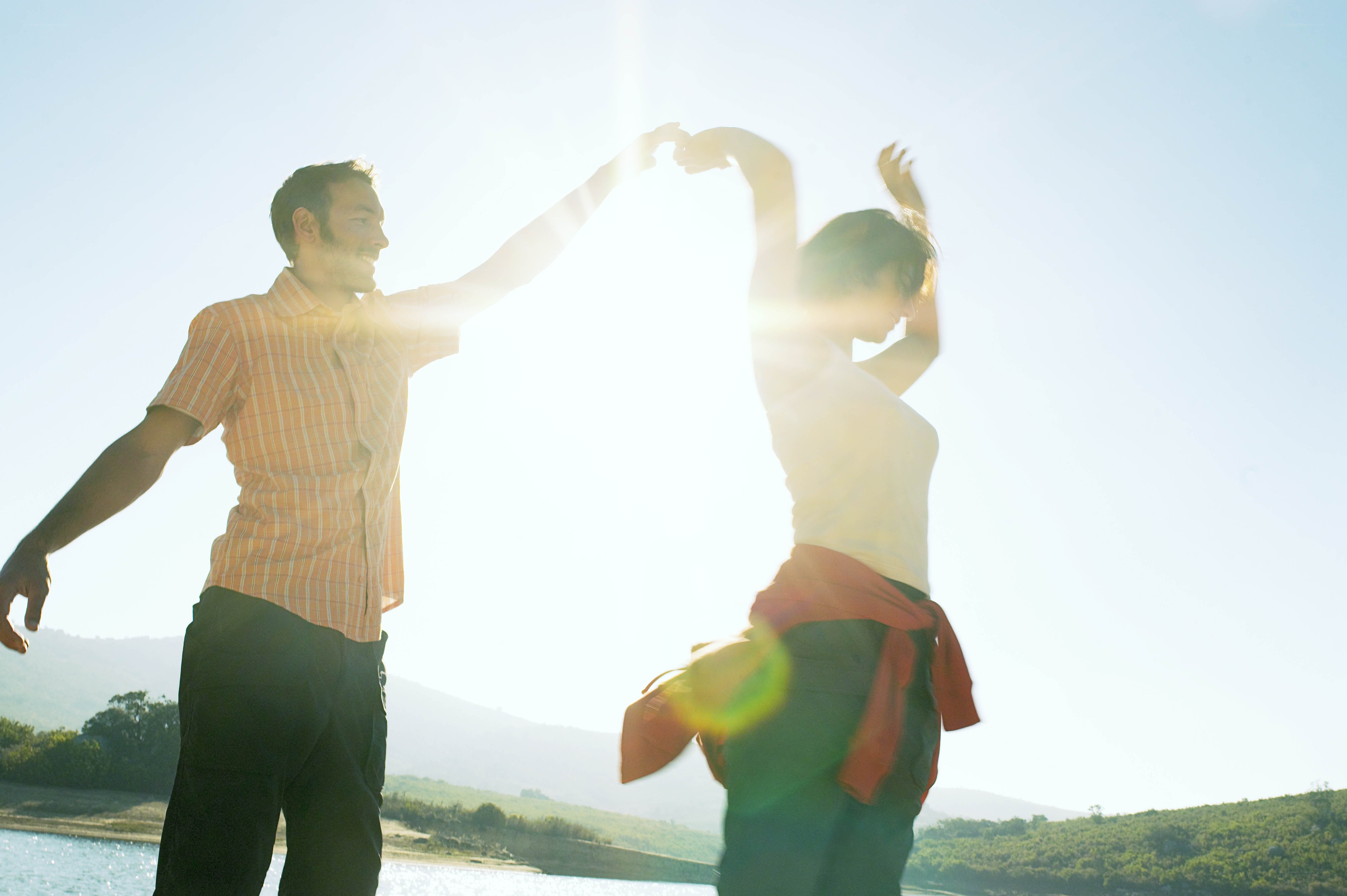 Couple dancing in sunlight