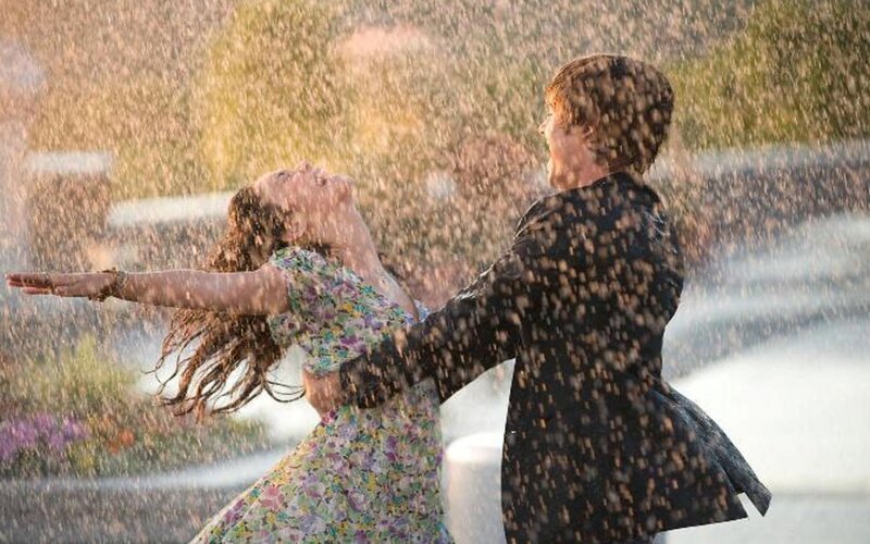 couple dancing in the rain