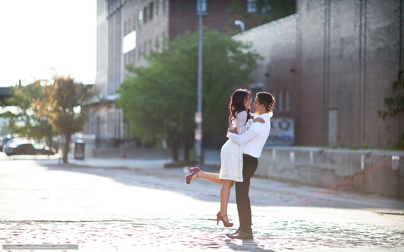 Couple dancing on cobblestone street