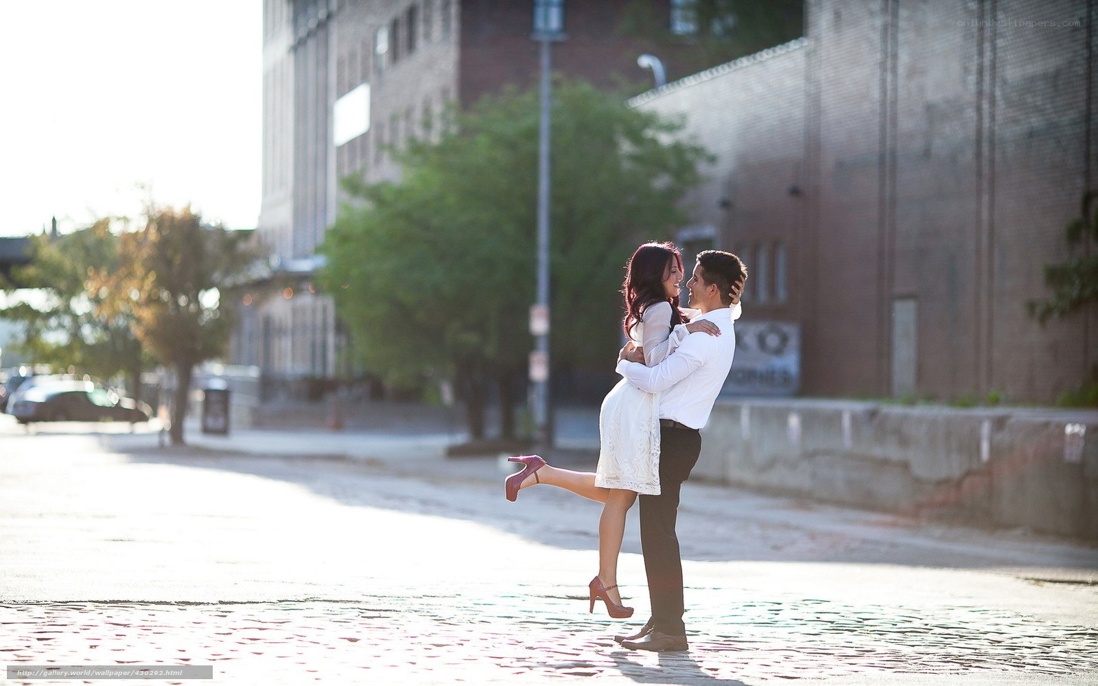 Couple dancing on cobblestone street