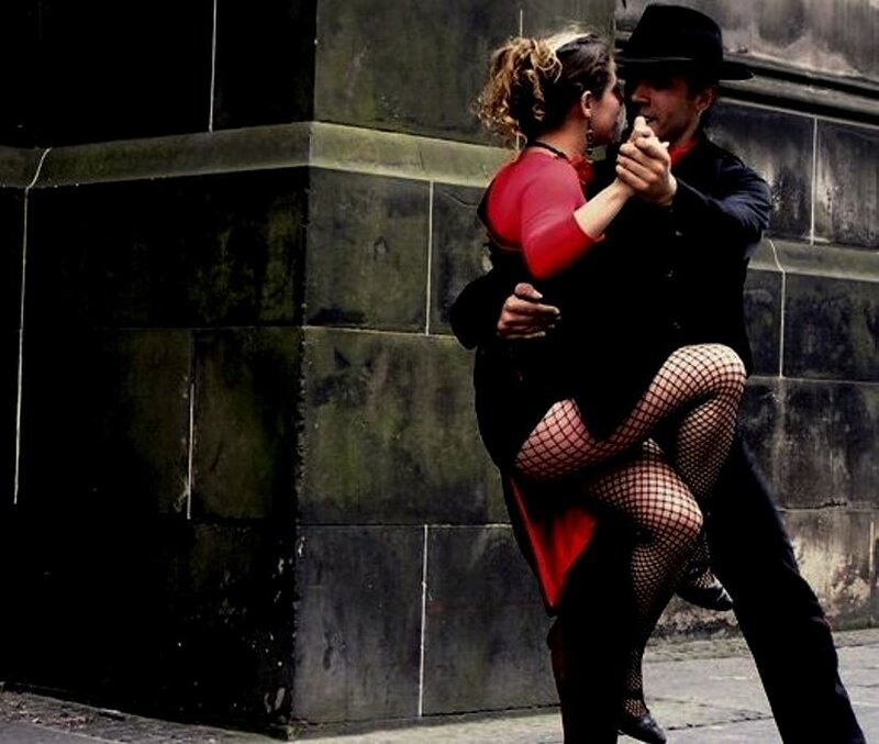 Couple dancing tango on street