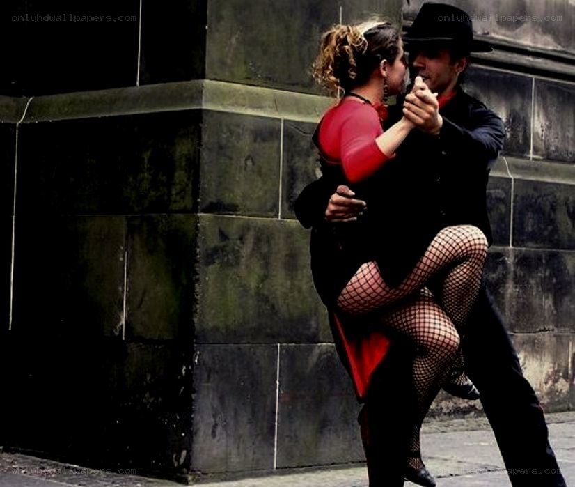 Couple dancing tango on street