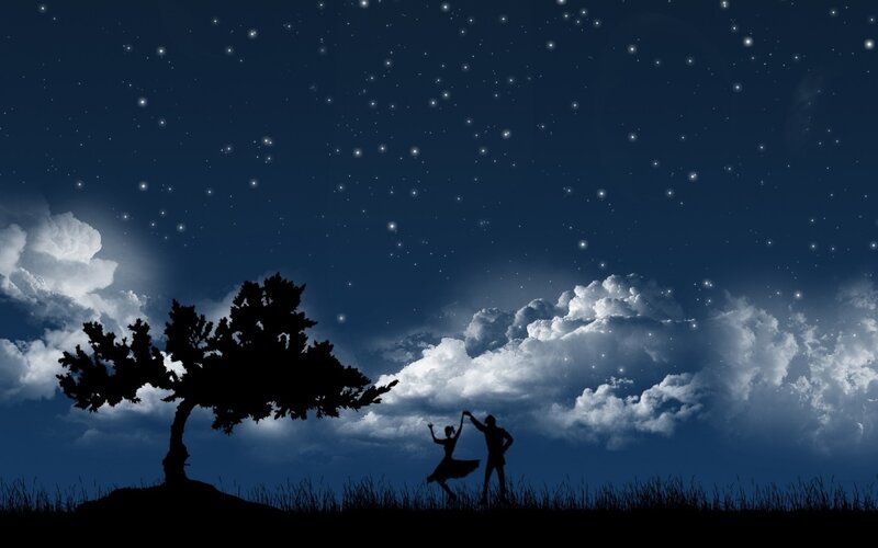 Couple dancing under stars