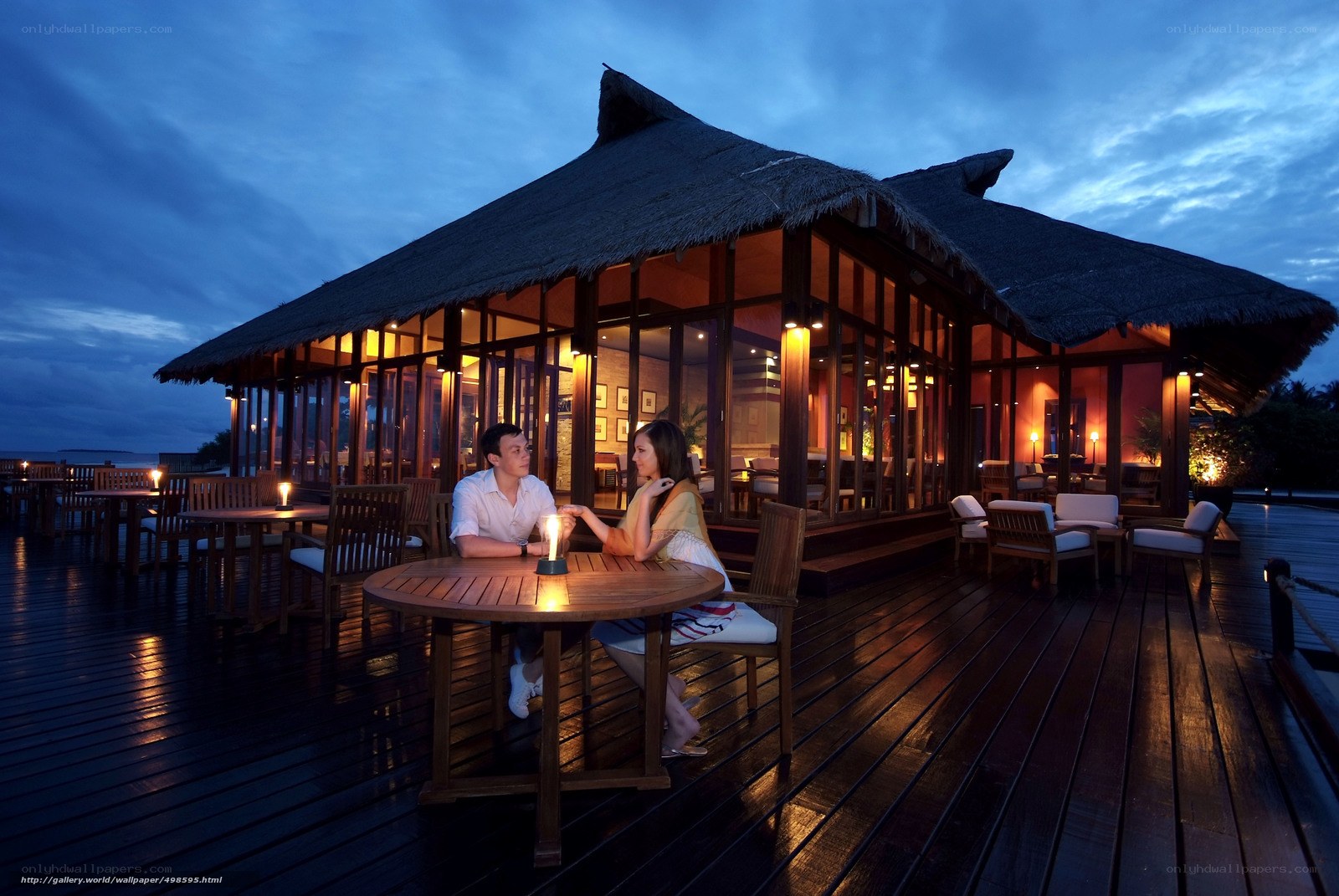 Couple dining at a beach resort