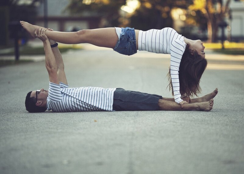 couple doing acro yoga