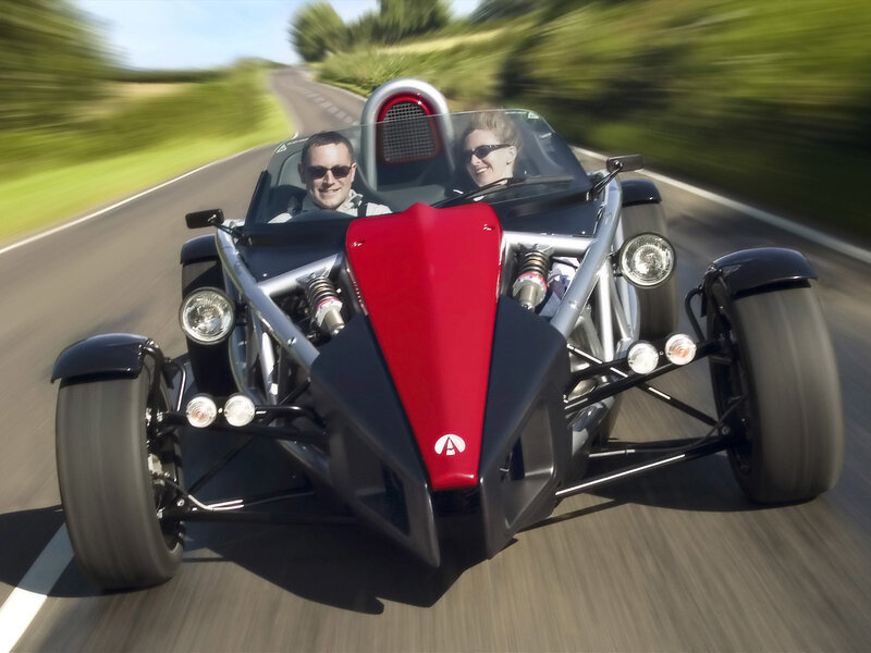 Couple driving a sports car