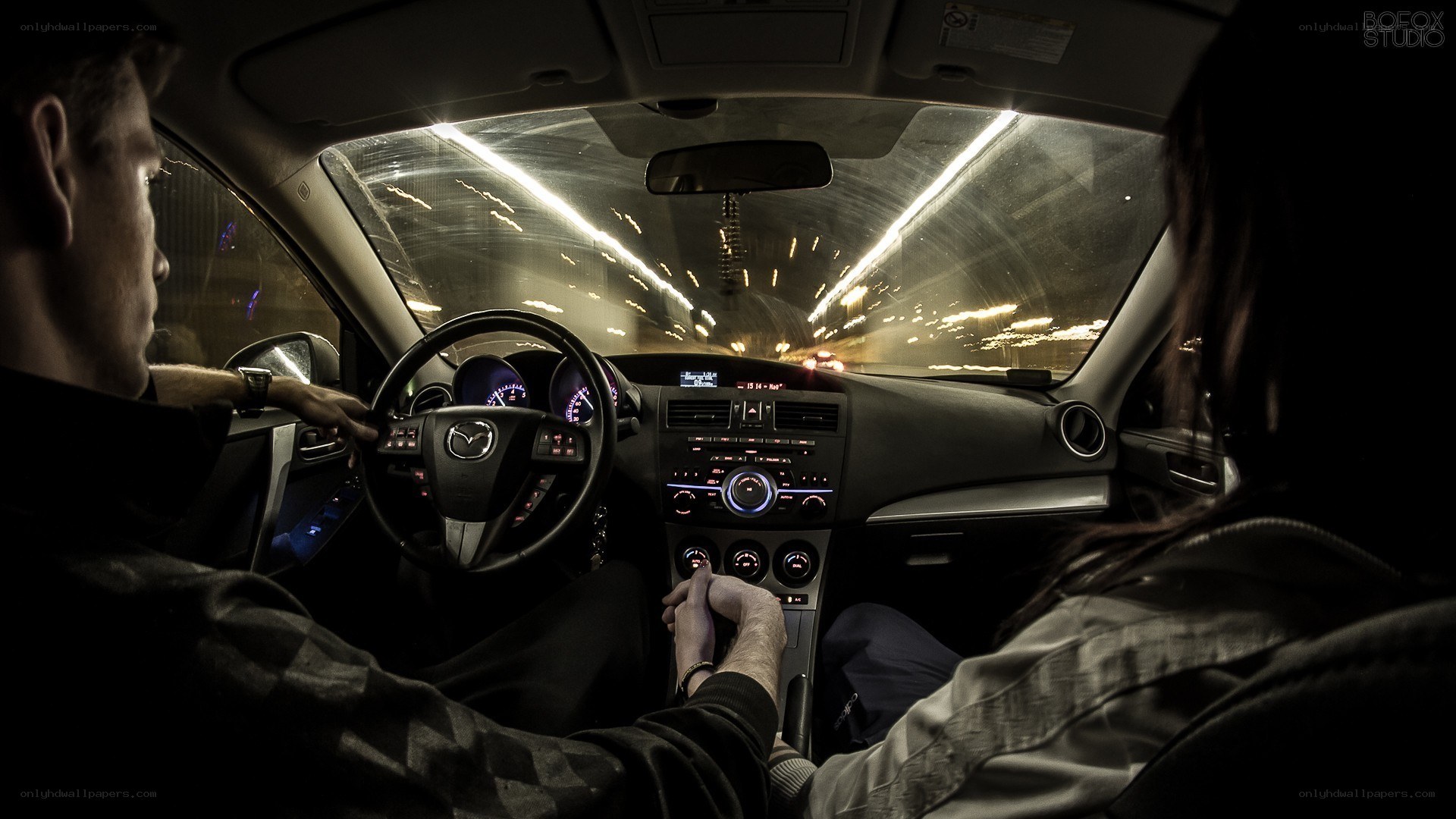 Couple driving at night