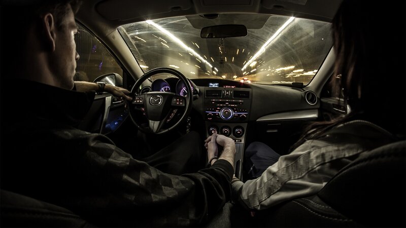 Couple driving at night