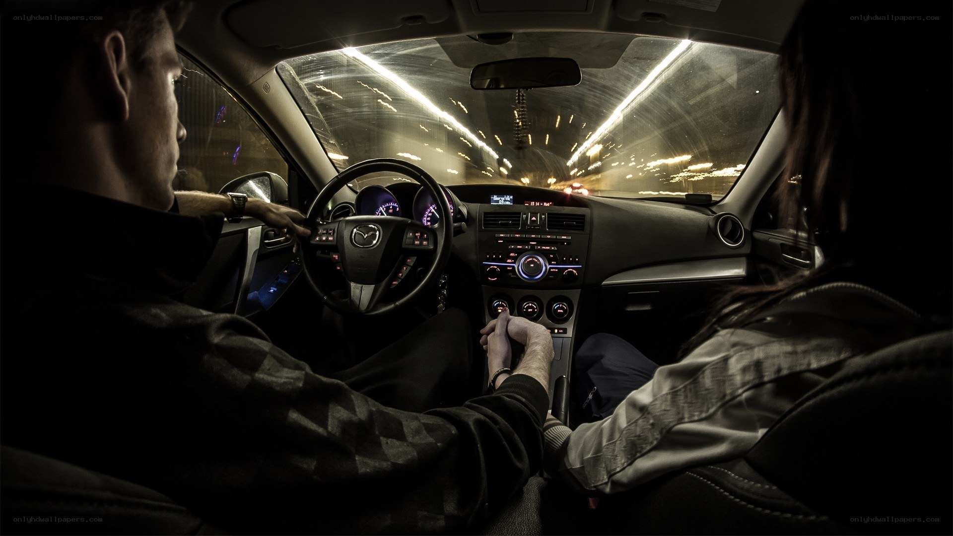 Couple driving at night