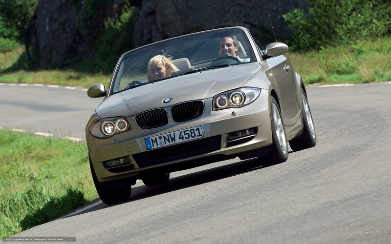 Couple driving convertible car