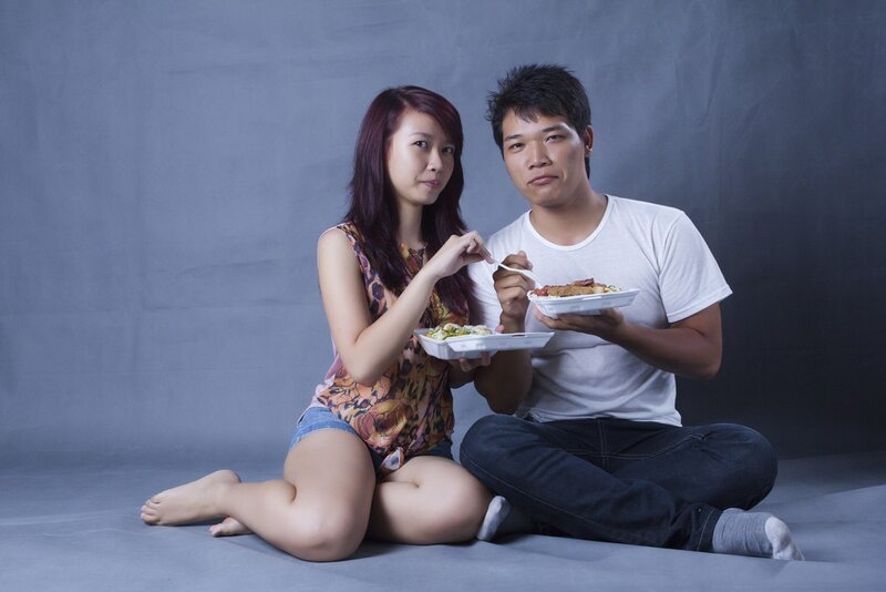 Couple eating takeout food
