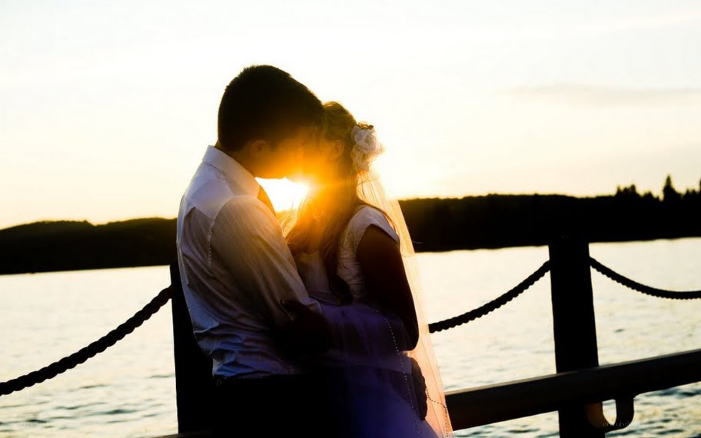 Couple embracing at sunset