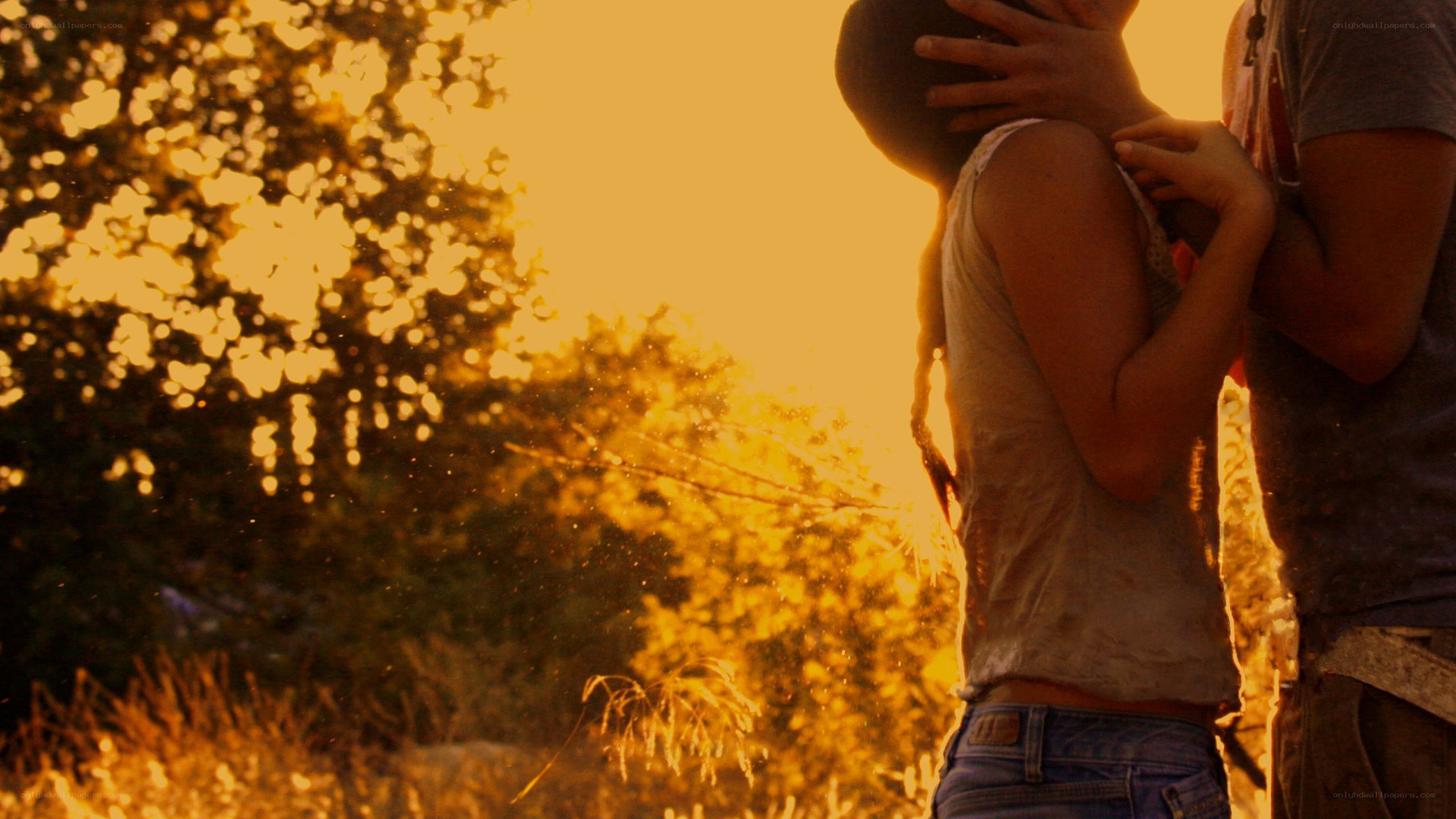 Couple embracing at sunset